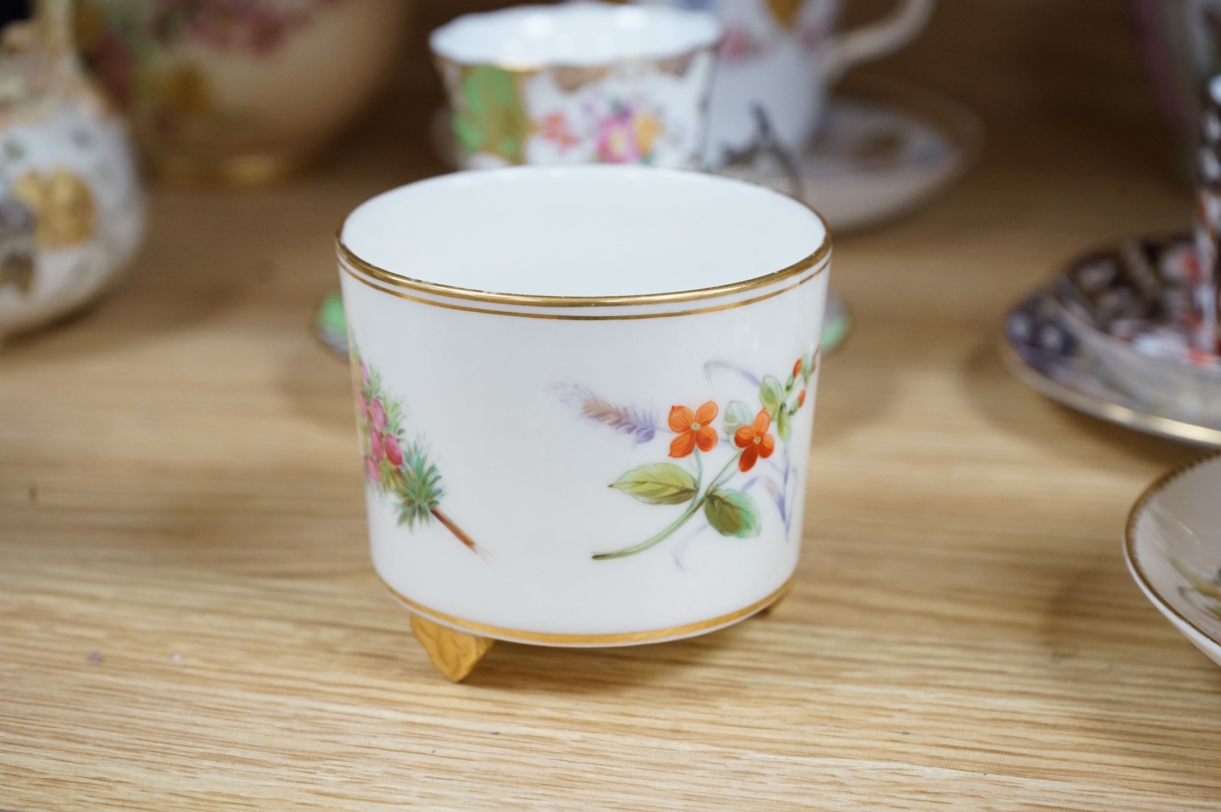 A Worcester butterfly handled cup and saucer and four other items, together with Royal Crown Derby, Dresden and Coalport items. (9). Tallest 13 cm